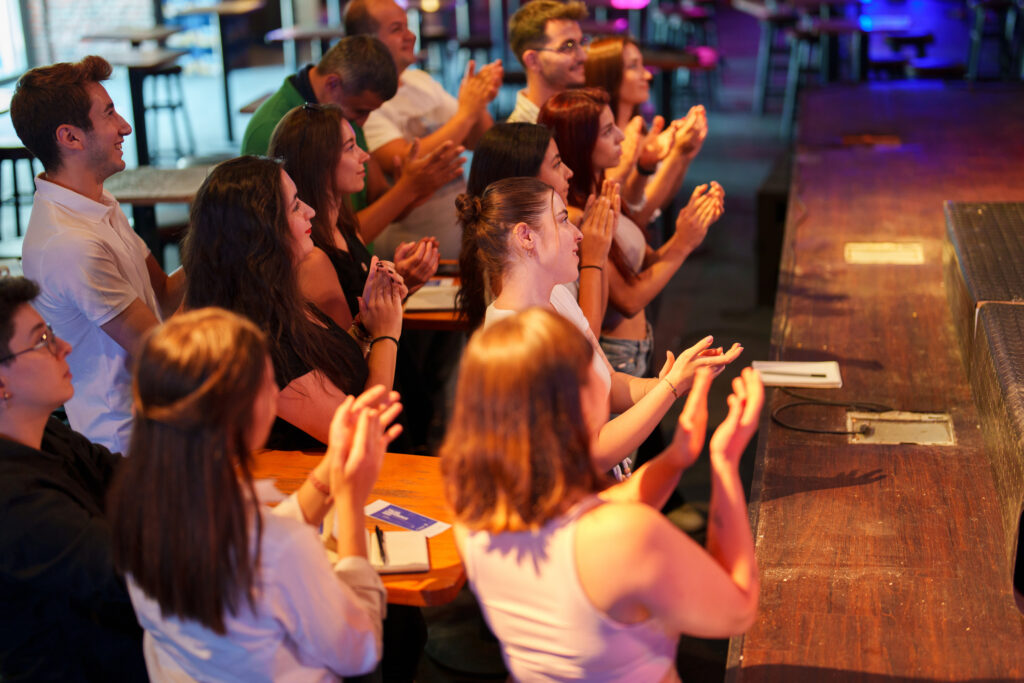 Audience watching the speakers on the stage at the conference